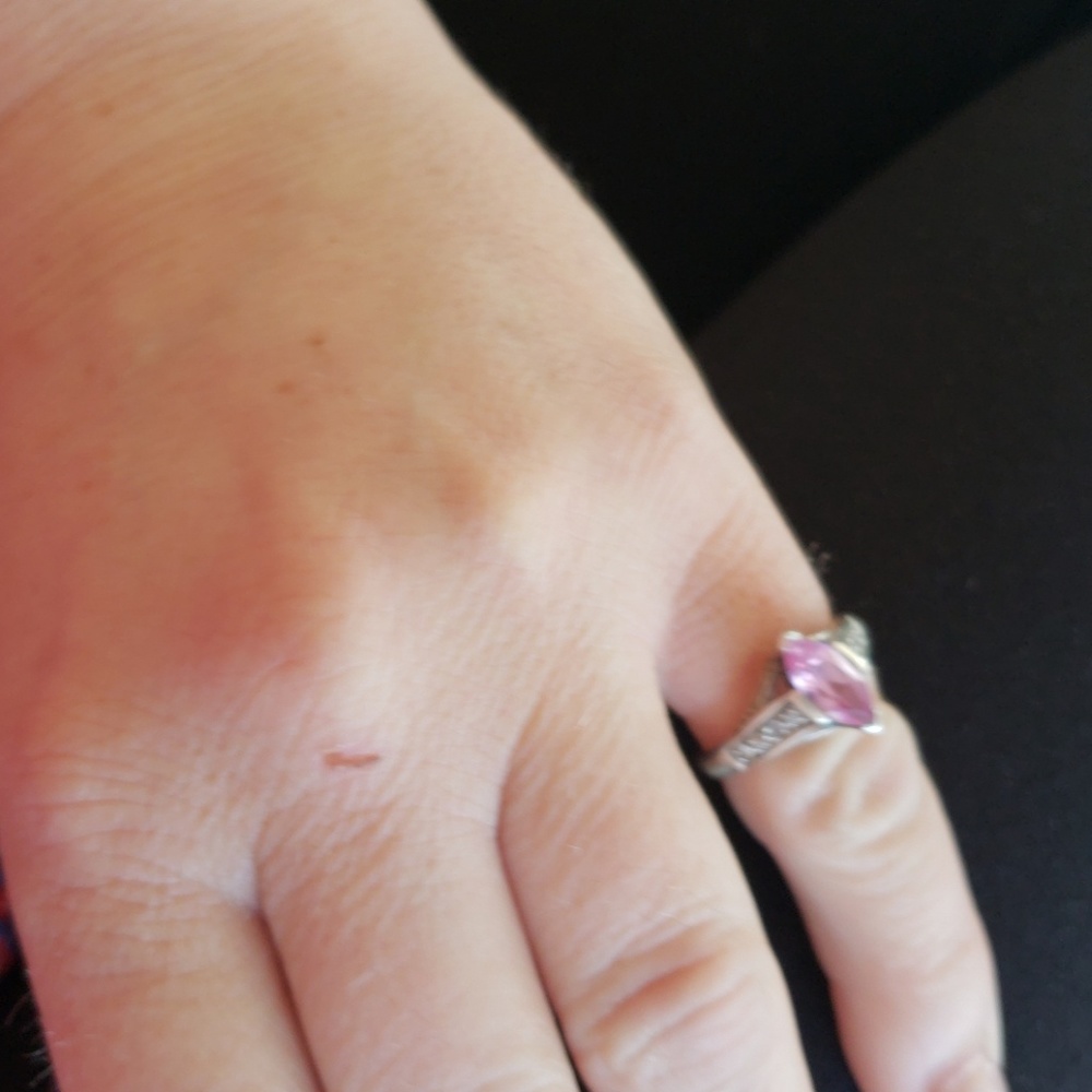 Sterling silver rind with pink stone and diamonds.
